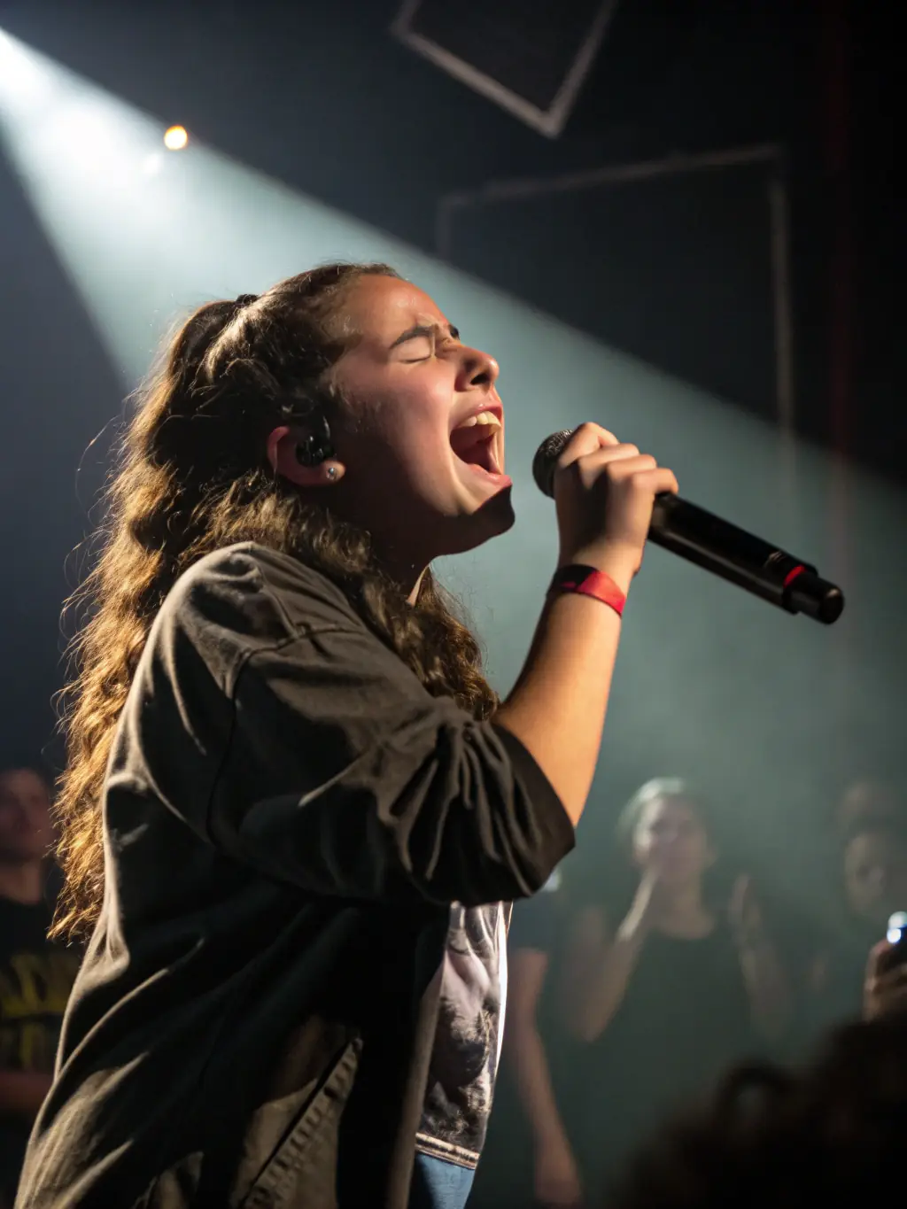 A captivating shot of a local artist performing on stage at a STAR event, promoting the organization's support for local talent and cultural enrichment.
